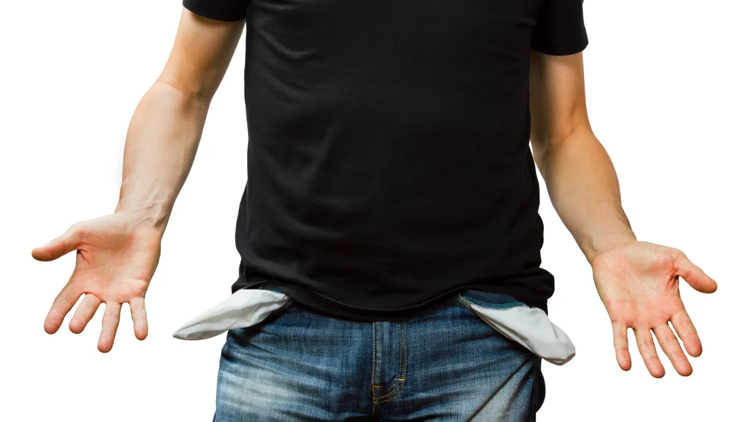 A man stands with his hands out, symbolizing a plea for assistance related to unemployment and loans.