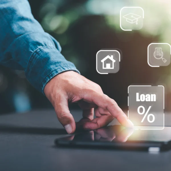 Hand touching a tablet screen displaying a loan concept, symbolizing the search for the best personal loan options.